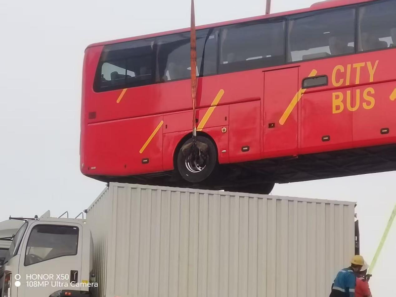 Custom-made bus successfully loaded onto the ship
